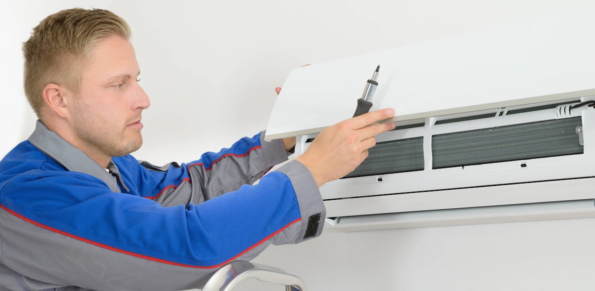HVAC technician servicing a ductless system